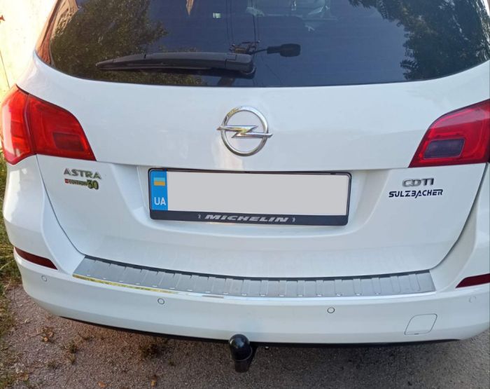 Накладка на задний бампер Carmos (SW, нерж) для Opel Astra J 2010-2024 гг